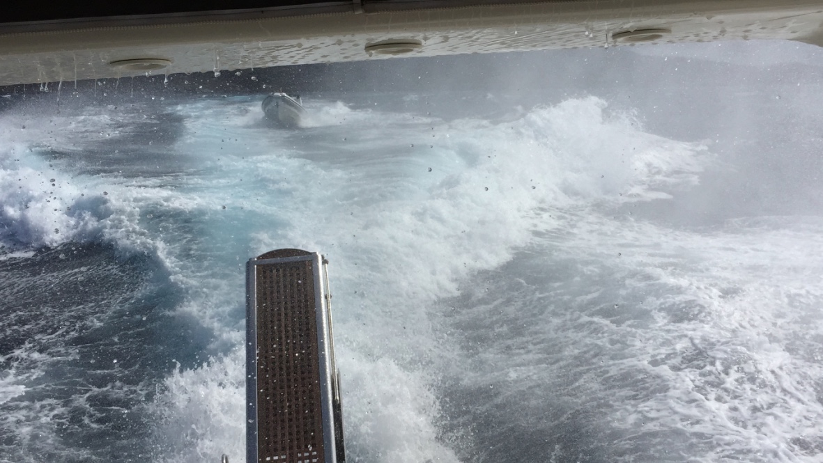 Chase boat following through open water