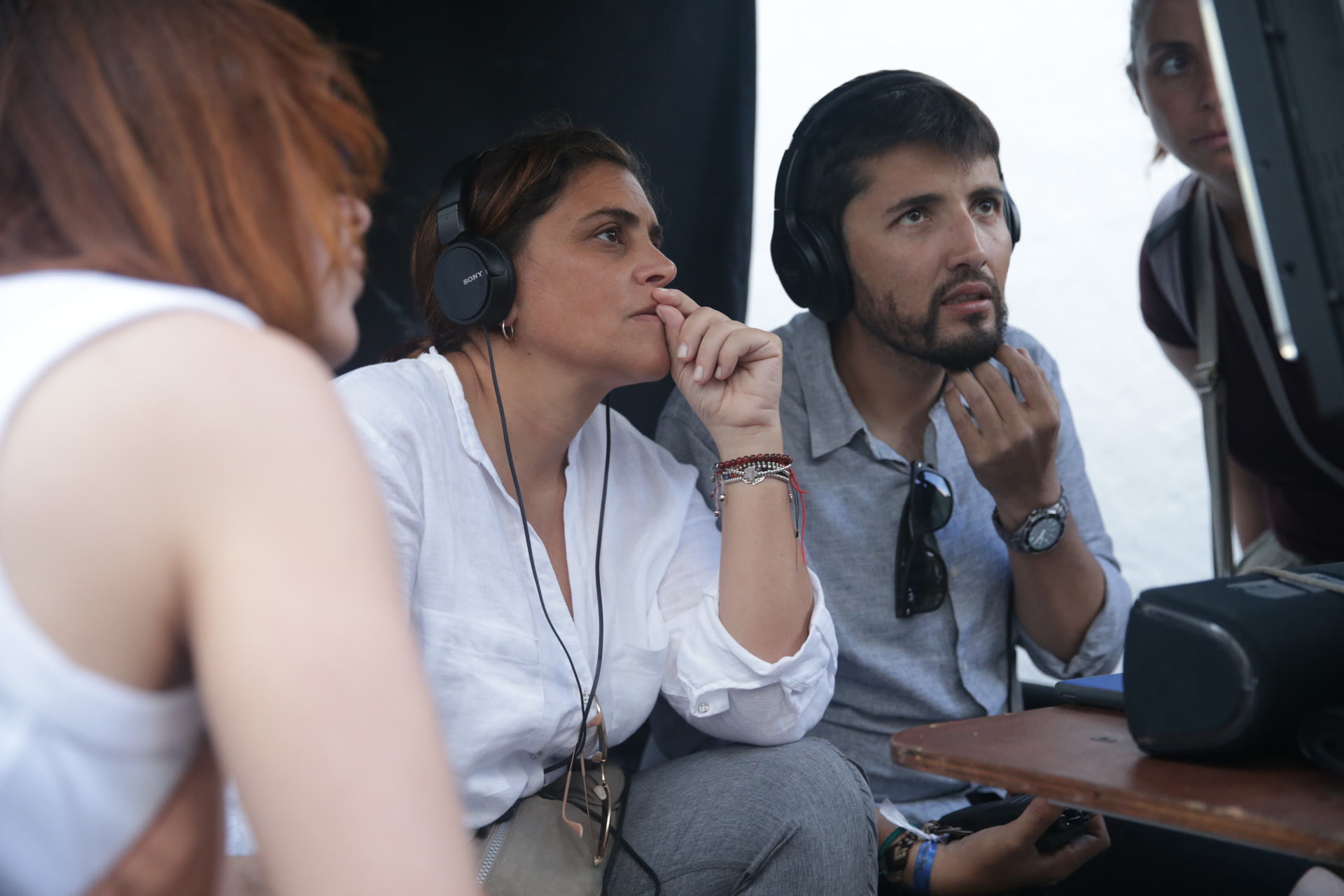 Director and production team monitoring a scene
