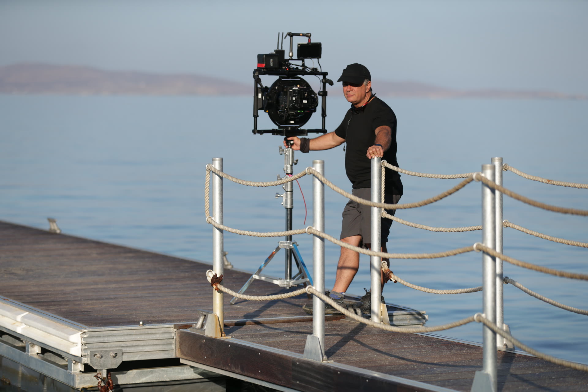 Camera technician preparing the stabilized camera rig