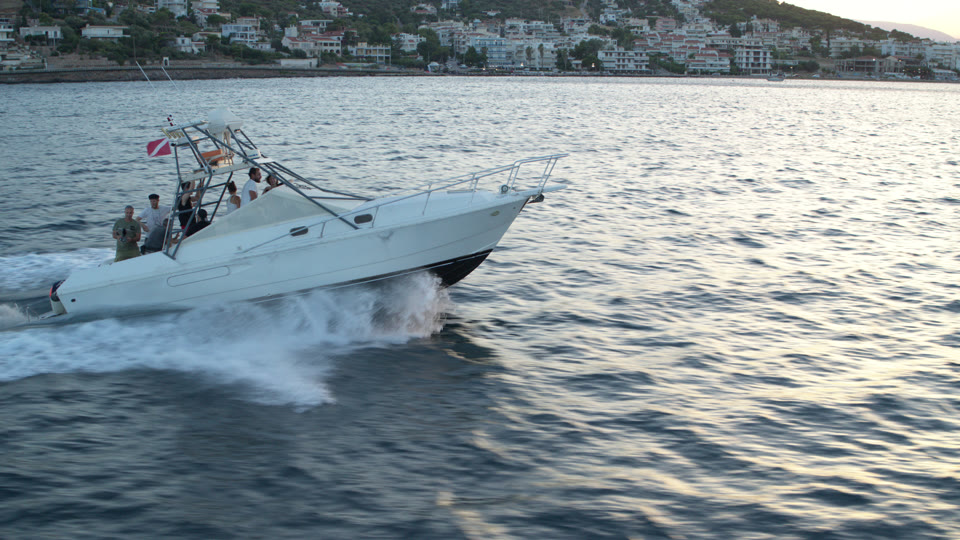 Camera support boat moving at speed near Porto Rafti