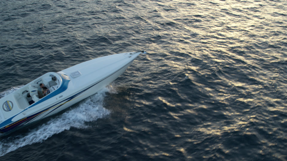 Aerial view of a yacht in open-water transit